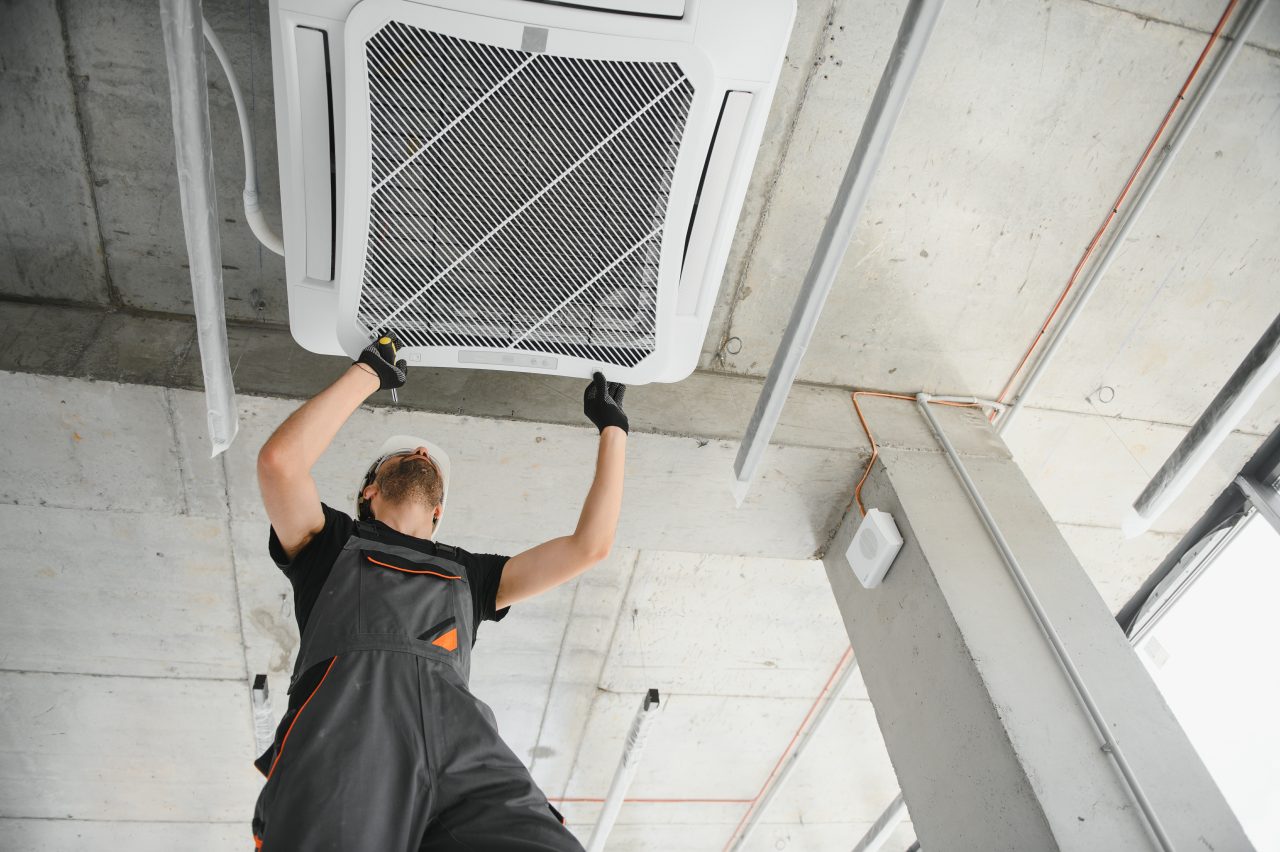 technician-cleans-air-conditioner-system-indoors-1280x852.jpg