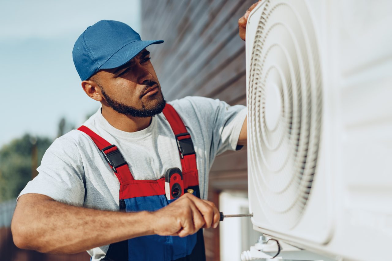 young-repairman-checking-an-outside-air-1280x853.jpg