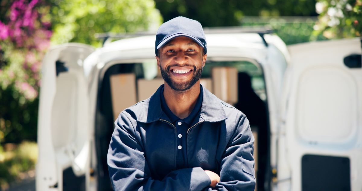 technician-standing-in-front-of-unbranded-van