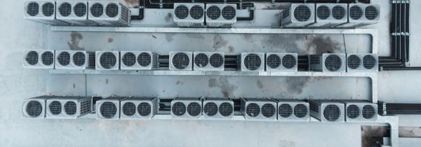 air-conditioner-on-a-building-rooftop-e1750267541753.jpg