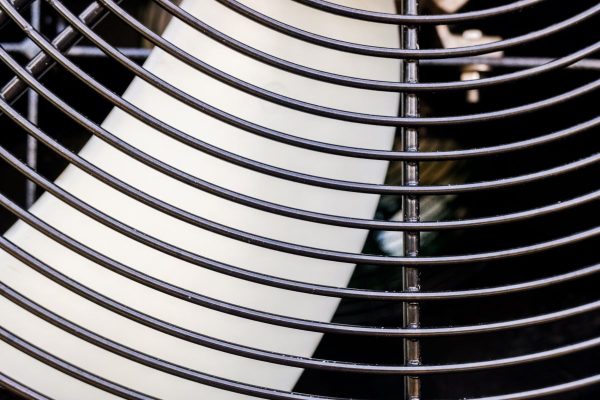 blades-of-an-industrial-fan-protected-by-a-grid-e1750261871520.jpg